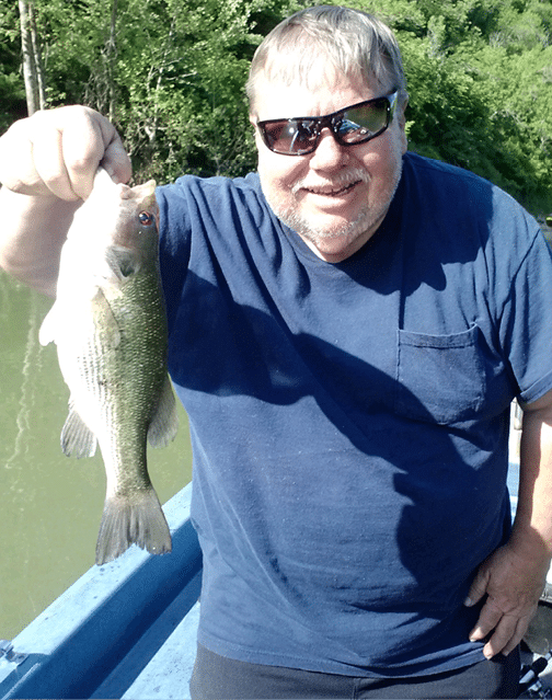 Alan Grant holding a fish