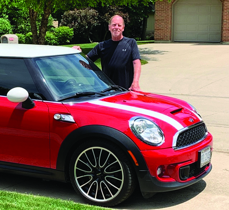 Mike Dingledine with his red mini cooper